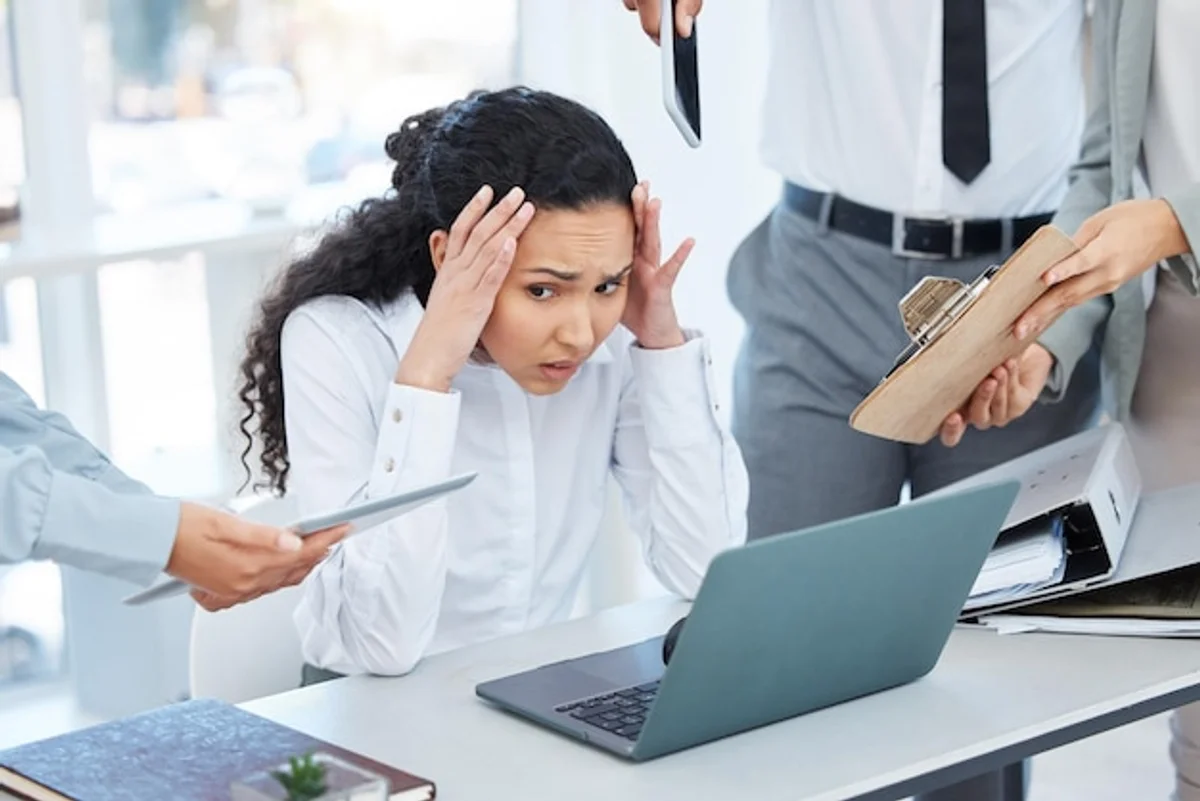 headache stress multitasking woman home