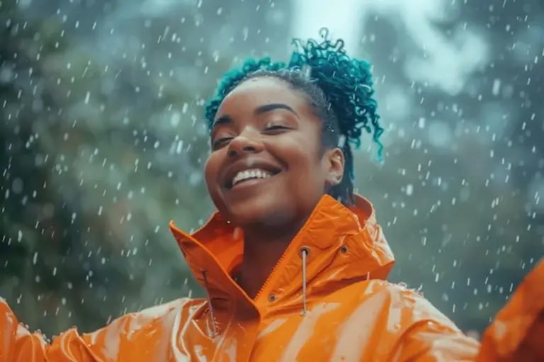 woman enjoying rain nature mood