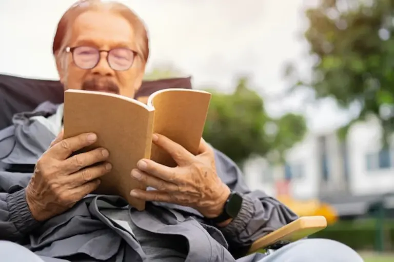 person reading old book looking thoughtful