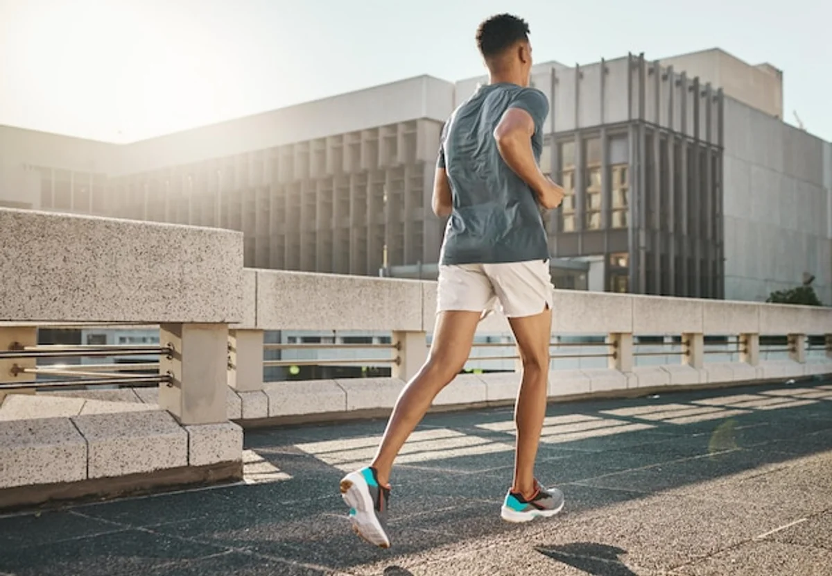 young man running city sunrise health motivation