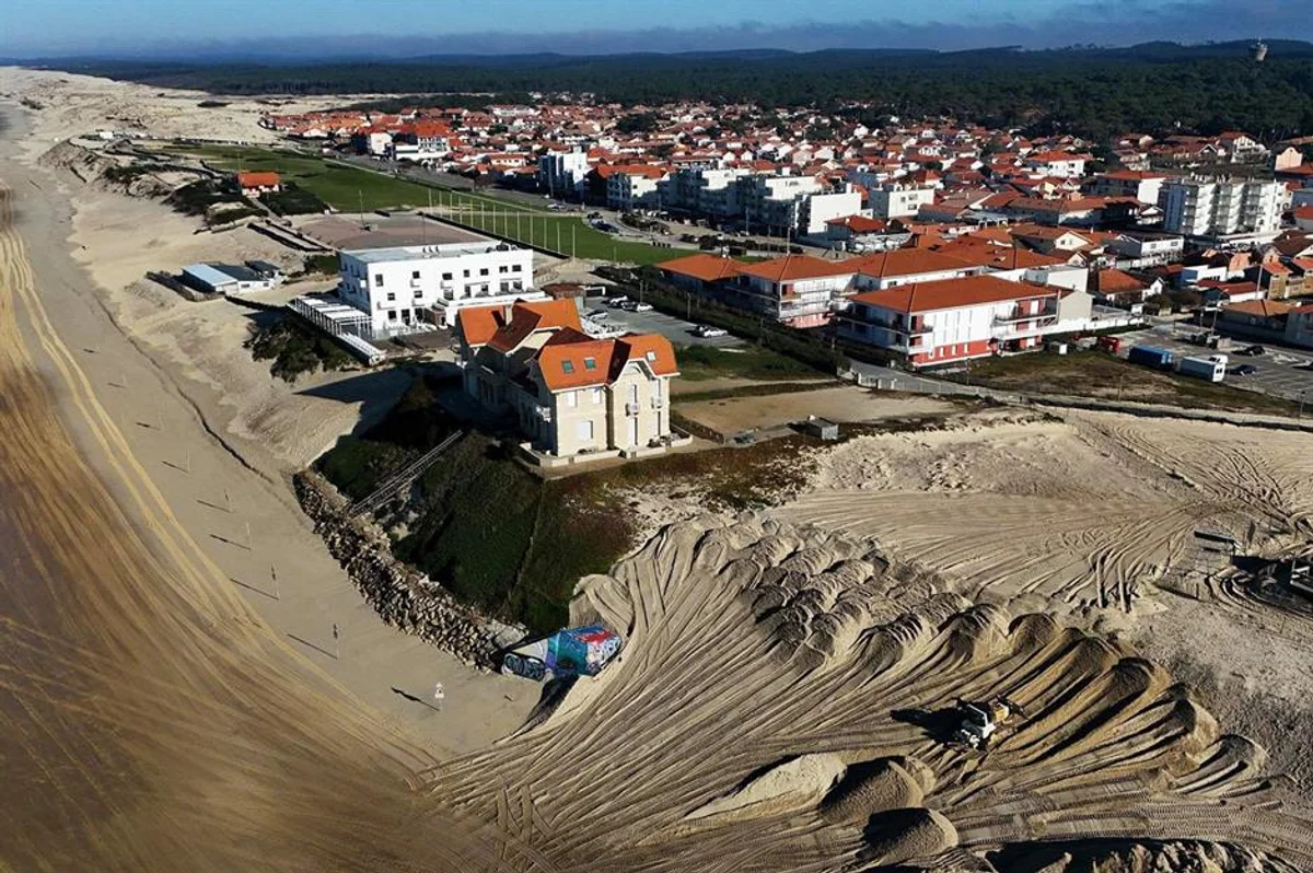 European coastline climate change threatened houses aerial