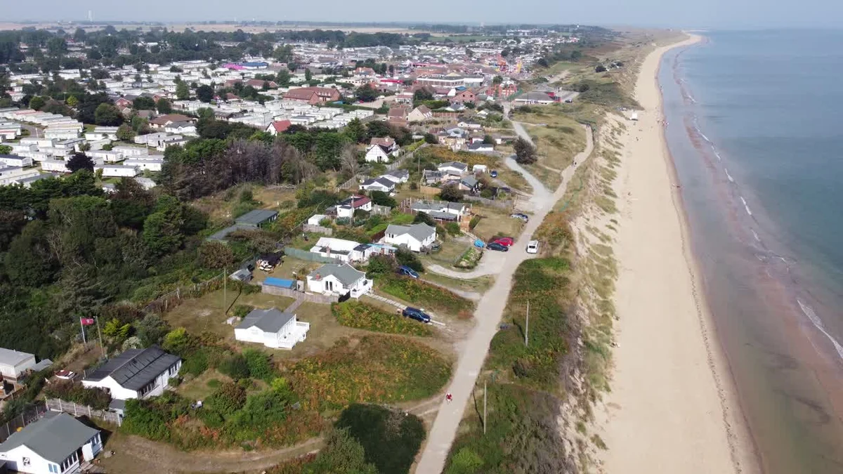 Eroded beach with coastal houses in danger Europe