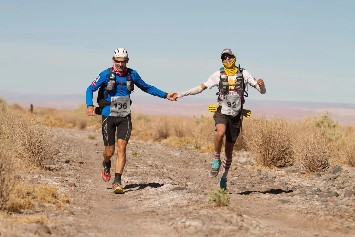 ultramarathon runner crossing desert finish line