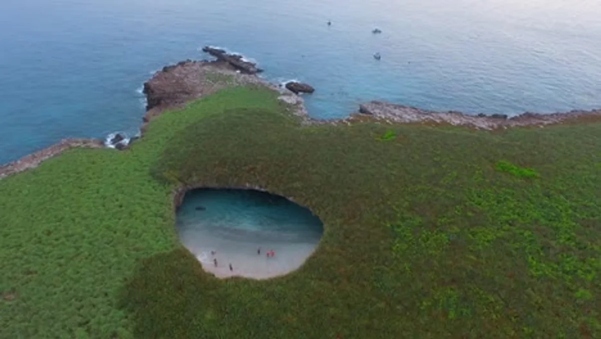 hidden beach with round rocks greece drone view