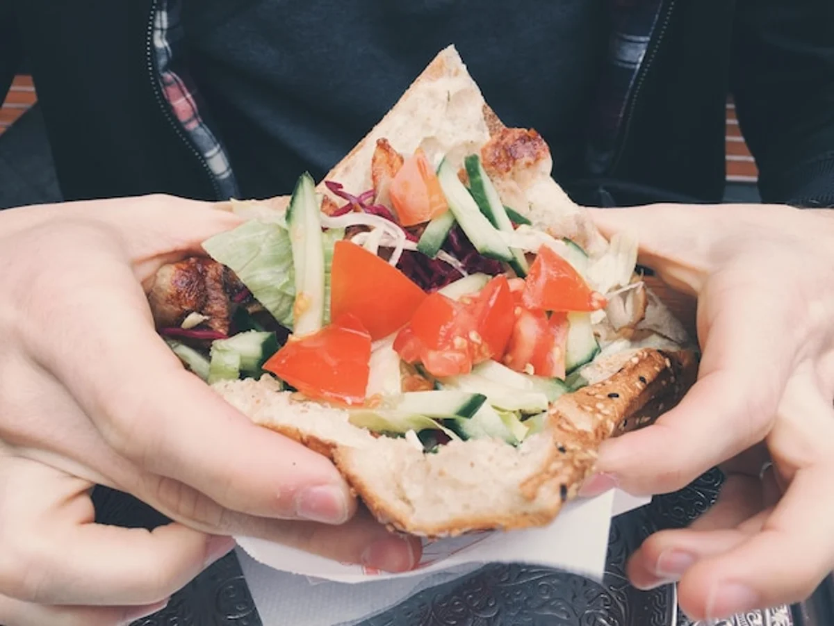 happy young people eating vegan food in Berlin