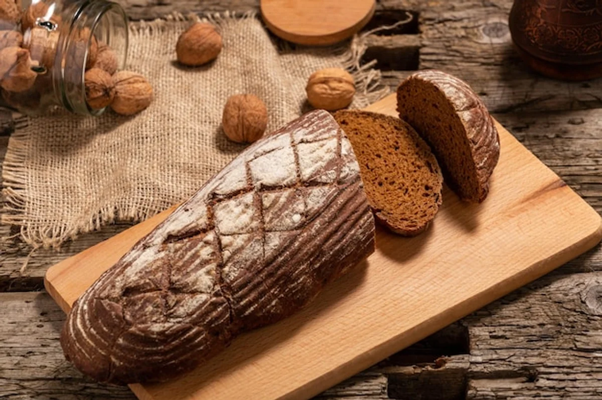 rustic german whole grain bread on wooden board