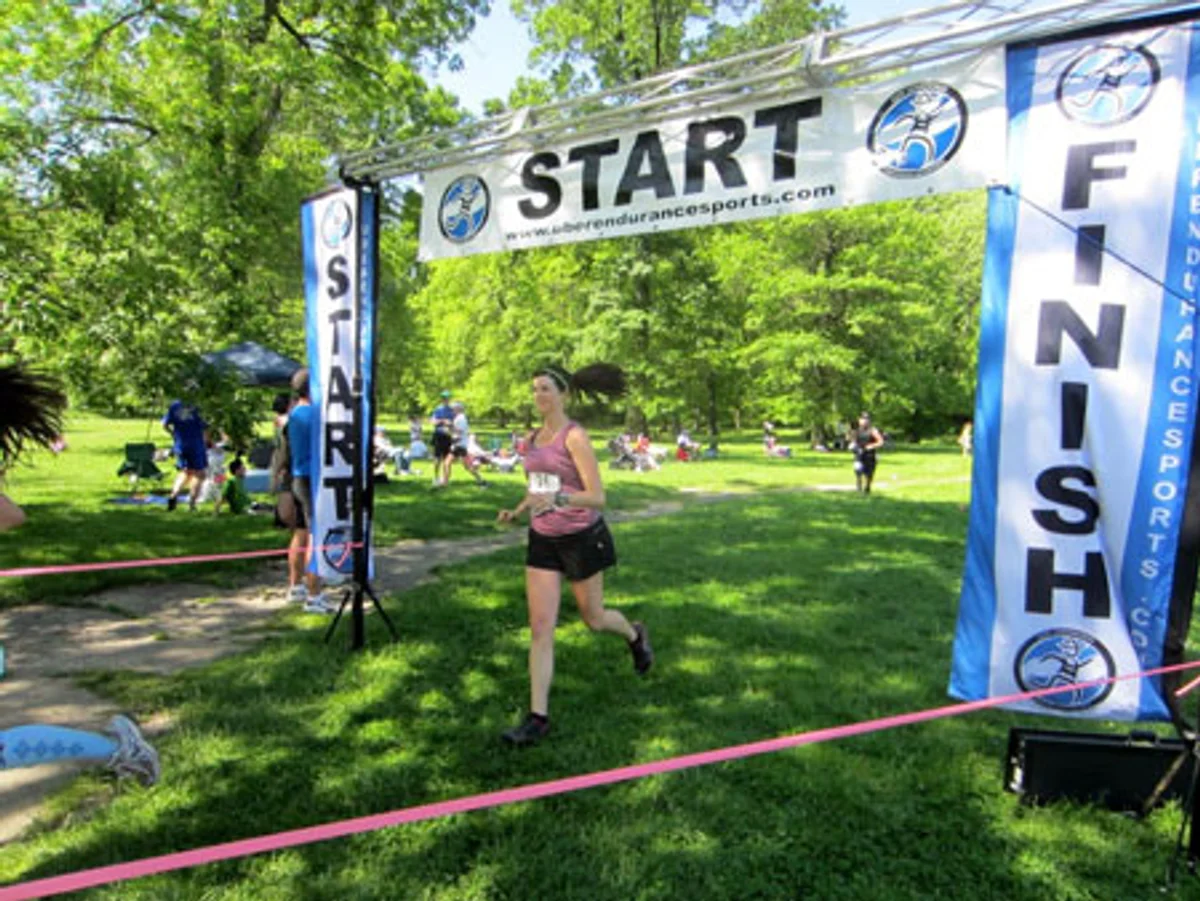 ultramarathon runner crossing finish line in german city