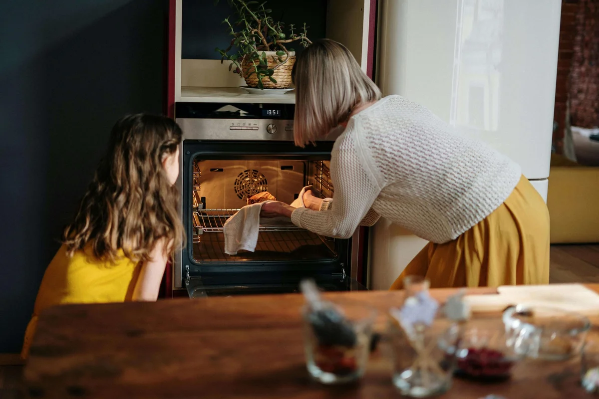 baking a cake, woman worried about sinking cake, home kitchen