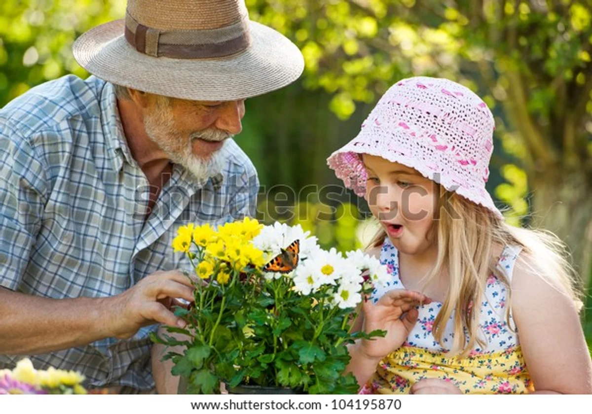 senior enjoying butterfly watching with grandchildren