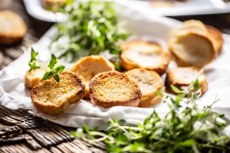 homemade croutons with herbs on baking tray rustic style