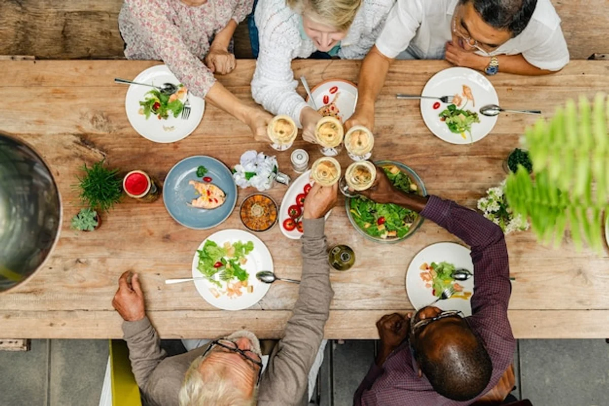 seniors enjoying healthy modern meal at table