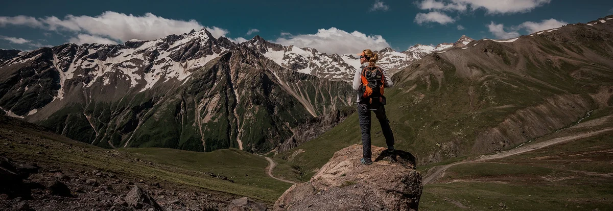 German hikers applying sunscreen mountain landscape