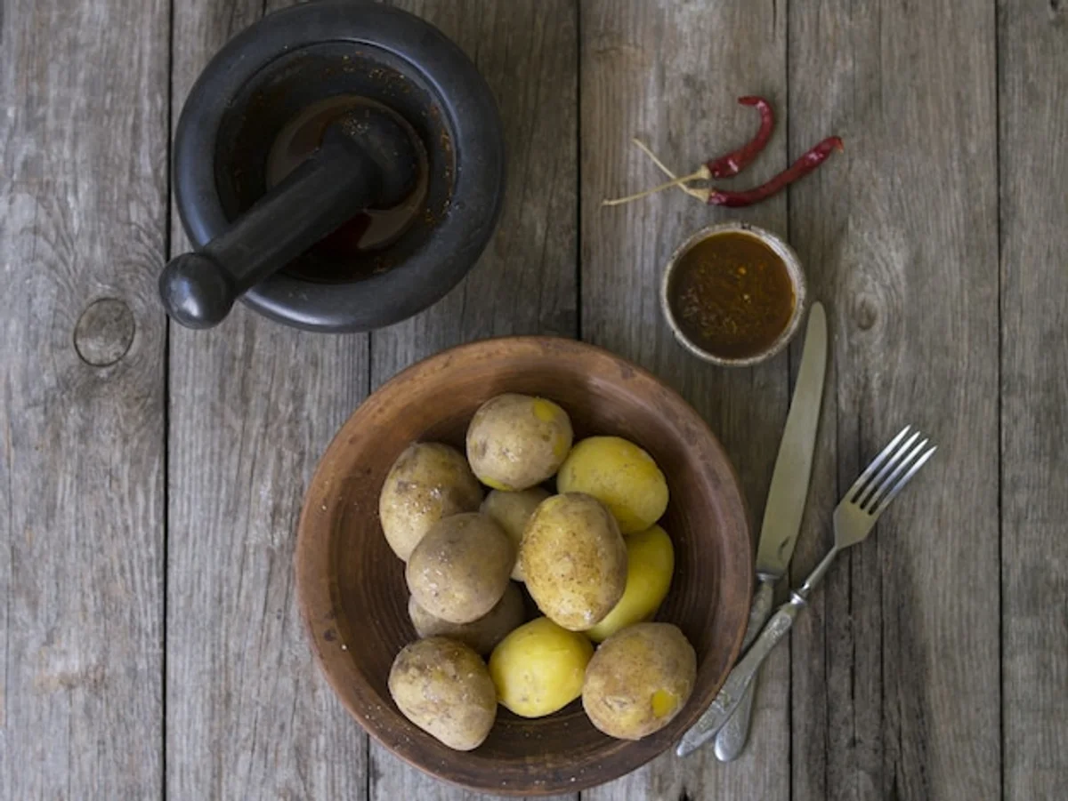 close up old potatoes on wooden table rustic