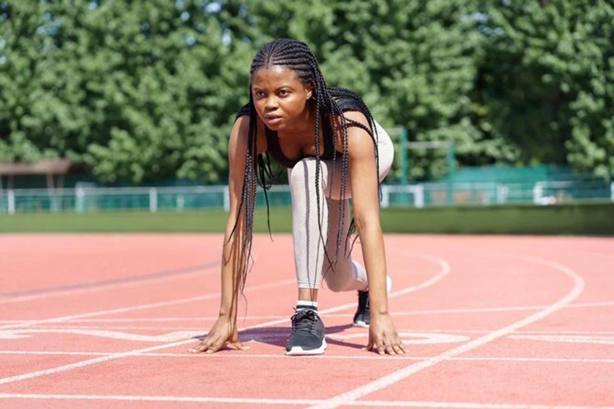 elderly woman athlete running track stadium record