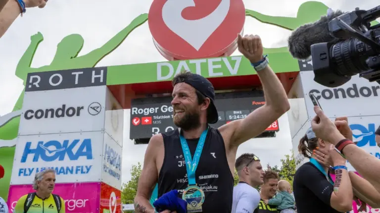 German triathlete breaking world record finish line celebration